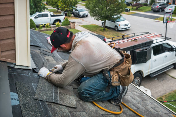 Professional Roofing technician working in Farmingdale, NY